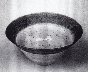Bowl, Lucie Rie, circa 1960. Porcelain; 9.5 in diameter.  One of Britian's potters, the Vienna-born Rie moved to London in 1938, where she exerted an influence on the postwar generation of ceramists.  Sgrafitto rims and monochrome glazes characterize many of her bowls.  Image courtesy Galerie Besson, London
